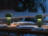 Bellhop Portable Table Lamp by Flos in green, shown unplugged with its compact, modern design and adjustable light.