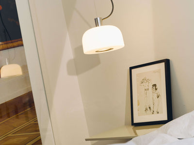 Bellhop Glass Suspension lighting fixture by Flos, featuring a sleek glass design and modern pendant style.