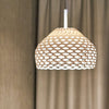 White Tatou Suspension light by Flos featuring a sleek, modern design with a smooth, rounded shade for contemporary interior lighting.