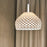 White Tatou Suspension light by Flos featuring a sleek, modern design with a smooth, rounded shade for contemporary interior lighting.