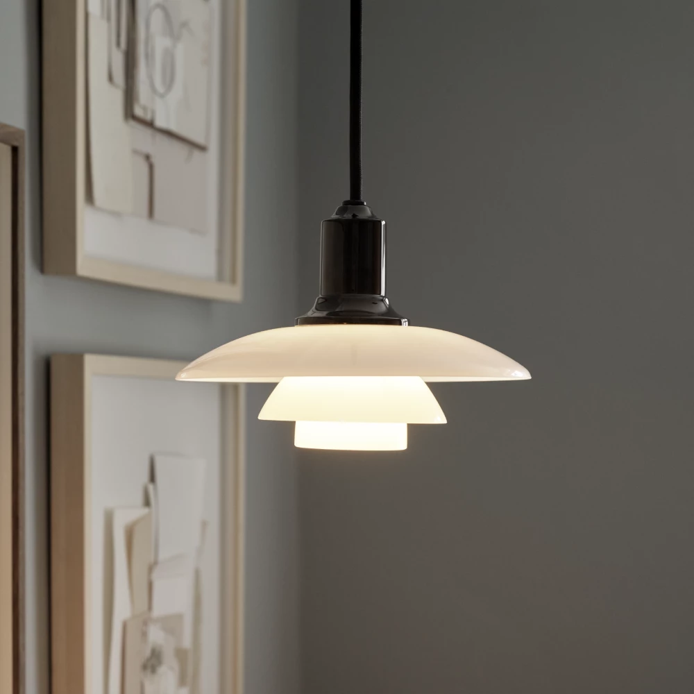 Chrome-plated PH 2/1 Pendant lighting by Louis Poulsen hanging with a sleek, modern design featuring a high lustre finish.