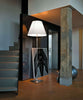Elegant Grande Costanza floor lamp by Luceplan featuring a sleek, modern lighting design with a slim stand and wide lampshade.