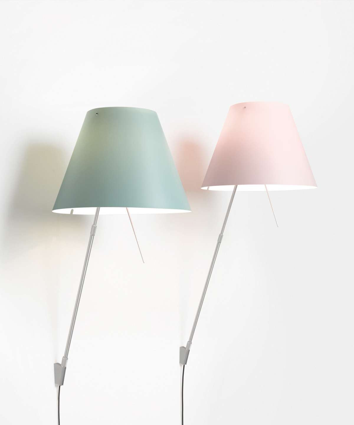 White Costanzina wall lamp by Luceplan, sleek modern lighting fixture with a minimalist design mounted on a wall.