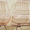 Lucy Chair by Bend Goods, modern metal seating with a woven design, shown in a close-up of the stylish, contemporary chair.