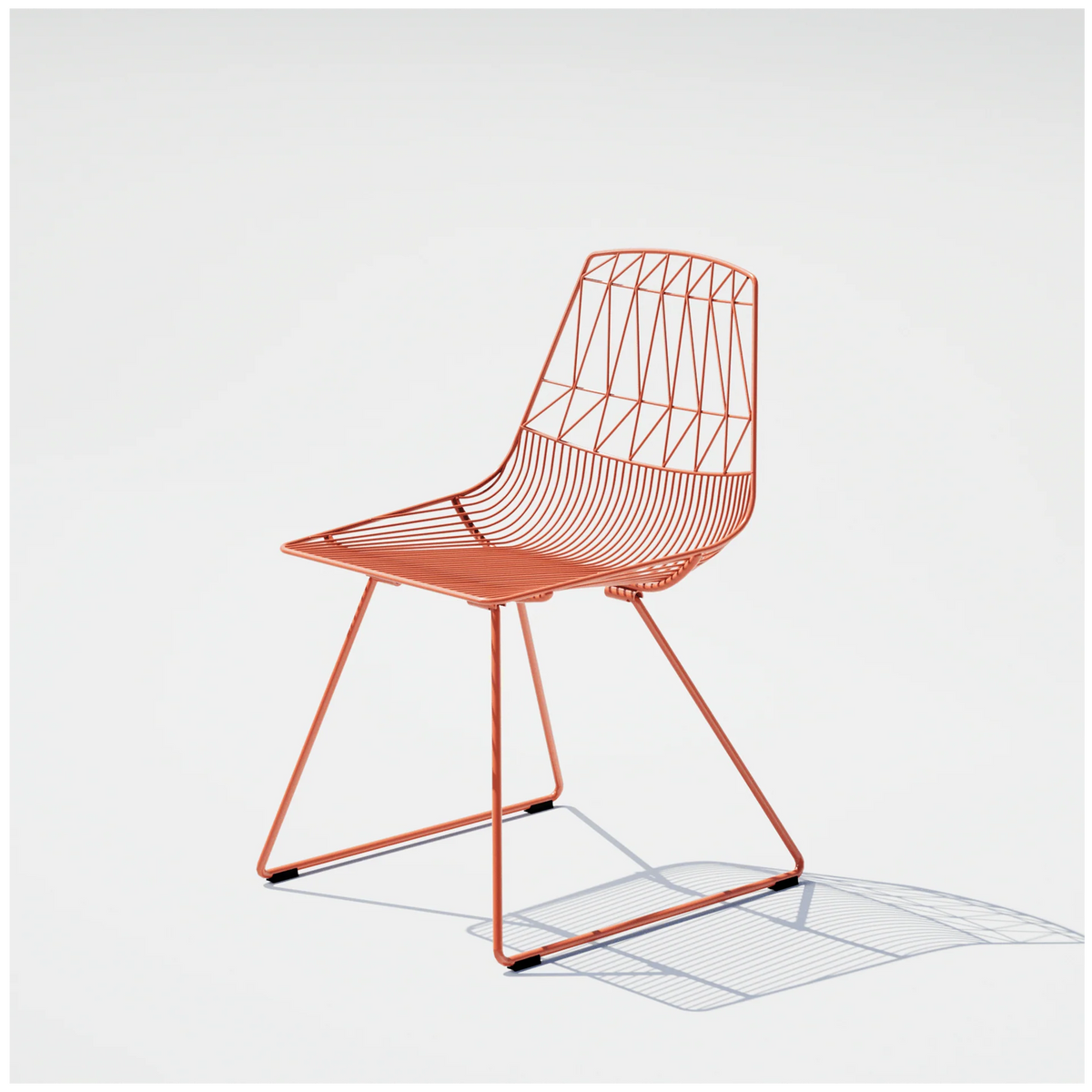 Lucy Chair by Bend Goods, stylish metal dining chair with a modern, minimalist design and curved seat for comfortable seating.