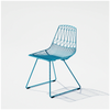 Lucy Chair by Bend Goods, stylish modern seating with a curved metal frame and woven seat, suitable for contemporary interior decor.