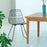 Black Lucy Chair by Bend Goods, modern seating with a sleek, minimalist design and curved metal frame.