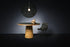Small black Moooi Random Light II lighting fixture with a 4-meter cord, showcasing its modern, playful design.