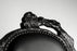 Smoke dining chair by Moooi featuring a sleek, modern design with a curved seat and backrest in a smoky gray finish.
