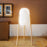 Rocket Floor Lamp by Newgarden featuring a sleek design with a tall, cylindrical shade and hemp cable for modern lighting.
