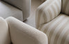 Swell sofa and armchair by Normann Copenhagen featuring modern seating with plush cushions and sleek design.