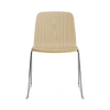 Black steel Just Chair by Normann Copenhagen, modern seating with sleek design and wooden ash legs, ideal for contemporary interiors.