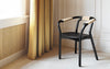 Black Knot seating by Normann Copenhagen, showcasing its sculptural, intertwined design and smooth surface.