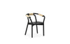 Black Knot seating by Normann Copenhagen featuring a woven design and natural wood legs.