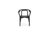 Black Knot seating by Normann Copenhagen, a modern sculptural chair with smooth curves and a natural finish.