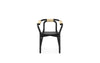 Black Knot seating by Normann Copenhagen, a modern sculptural chair with a sleek, natural finish and unique knot design.