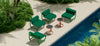 Bend Outdoor Tube Lounge seating with side table, featuring tubular metal frame and comfortable cushion for outdoor relaxation.