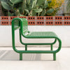 Bend Goods Outdoor Tube Lounge seating with a curved, modern design in a vibrant outdoor setting.