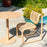 Round pedestal cafe table by Bend Goods with a tan outdoor finish, featuring a sleek design suited for outdoor dining spaces.
