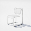 Outdoor Tube Chair by Bend Goods featuring a modern, tubular metal frame and woven seating for stylish outdoor seating.