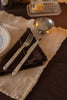 Set of four Lorena Canals handloom napkins in earthy tones, perfect for table decor and everyday accessories.