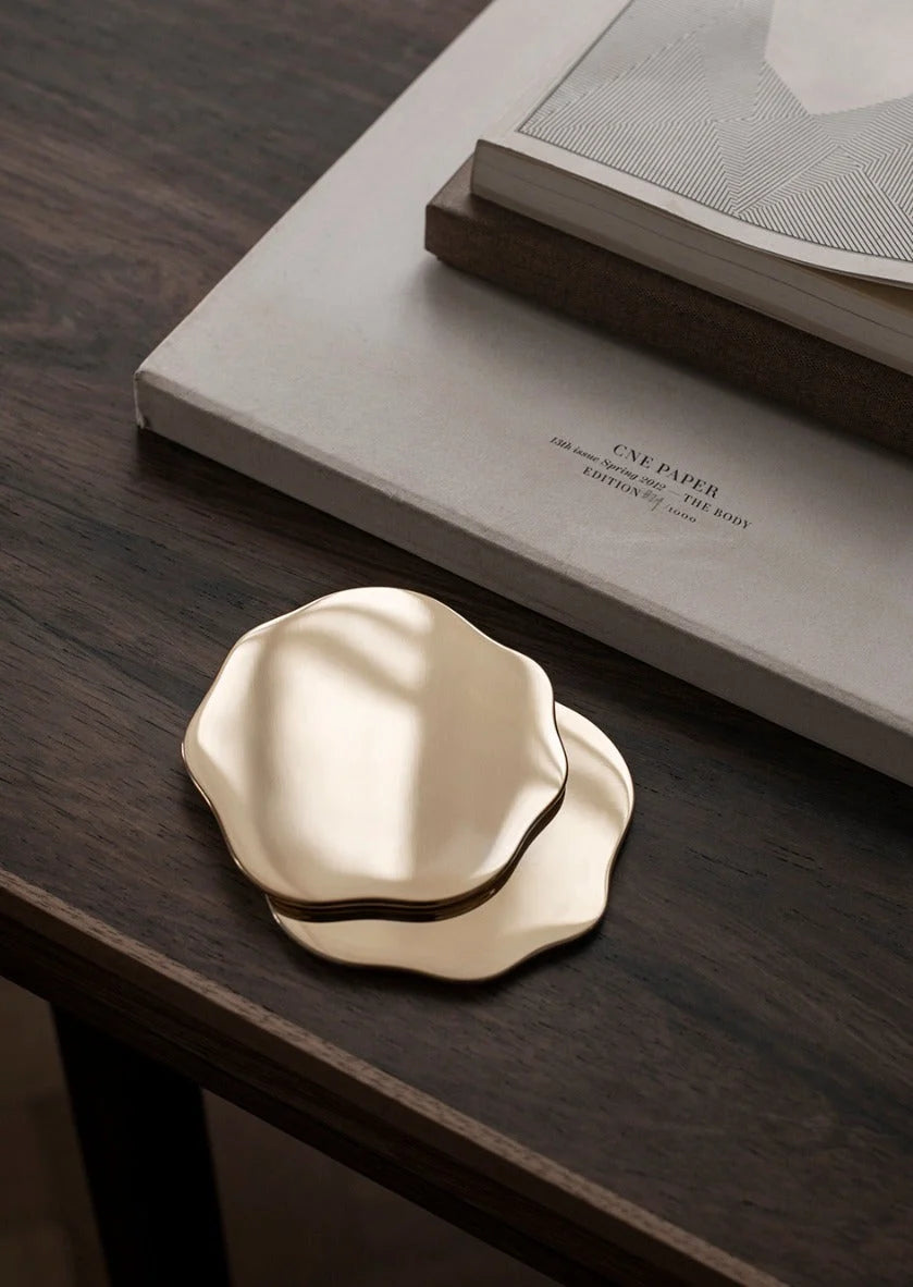 Set of two Skultuna Veermakers Bluebell coasters with elegant blue floral design, made of high-quality accessories material.