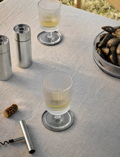 Stelton Arne Jacobsen salt and pepper mill accessory with sleek design, featuring stainless steel and wooden accents.