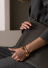 Gold plated Massive Knot cuff bracelet by Skultuna, featuring a bold knot design in a stylish accessories image.
