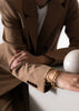 Skultuna Apart Cuff accessory featuring minimalist metal design with smooth, polished finish and adjustable strap.