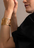 Skultuna Dew Cuff accessory featuring sleek, modern design with textured metal finish, displayed on a neutral background.