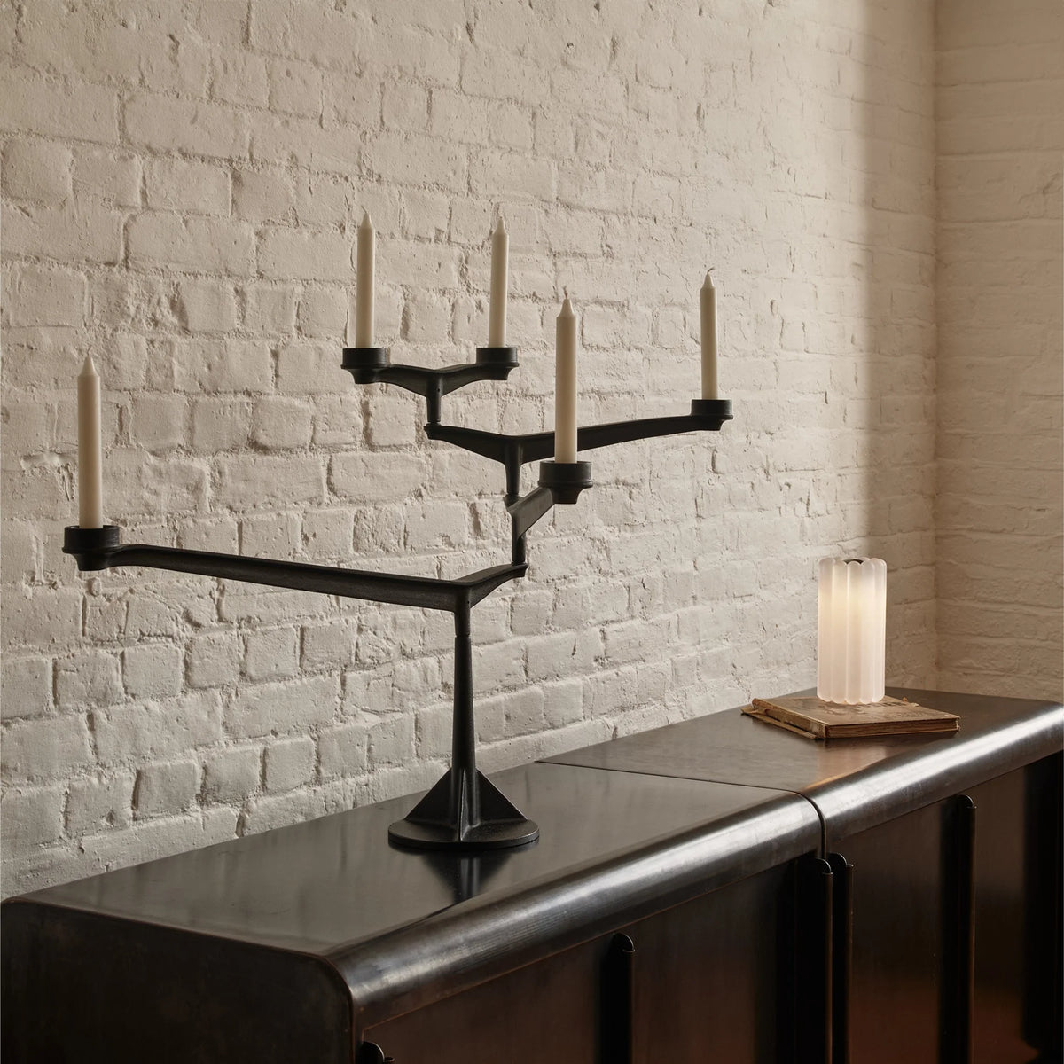 Large black Spin Candelabra by Tom Dixon, modern accessories with multiple candle holders and sleek design.
