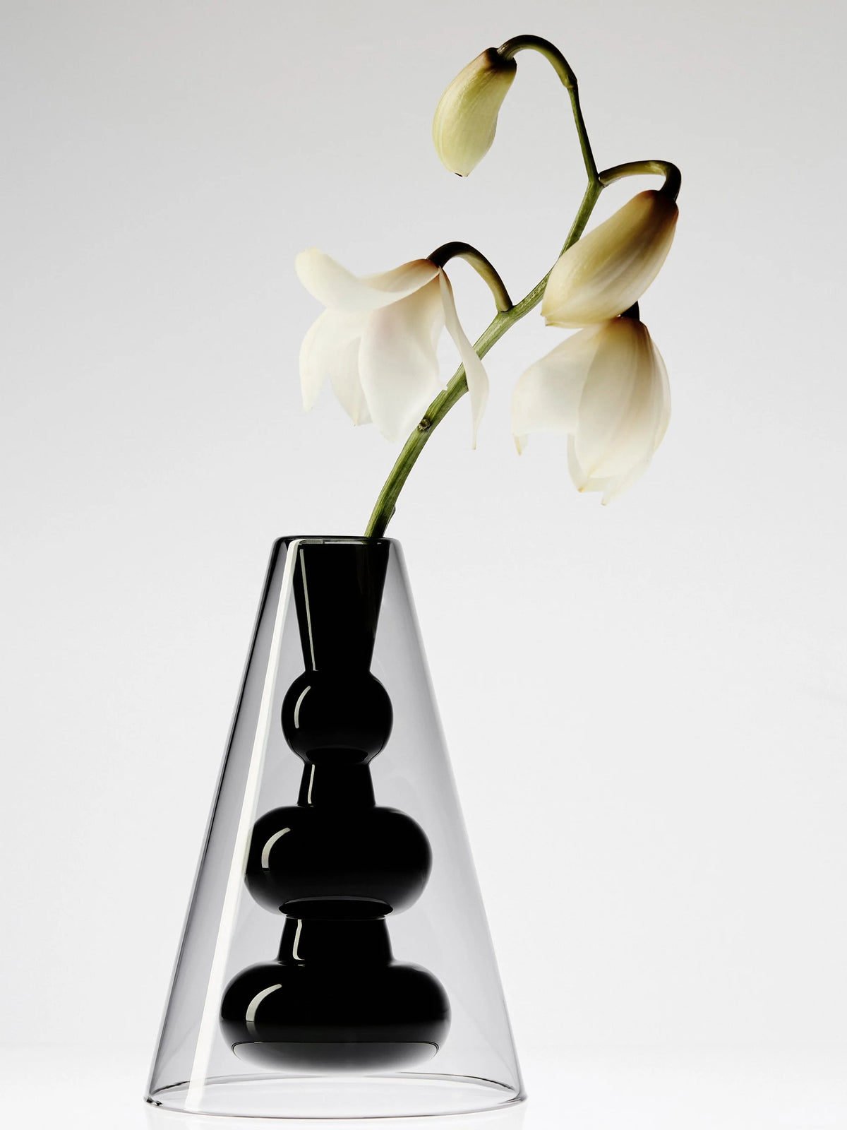 Tom Dixon Bump Vase Cone in a sleek, modern design, showcasing its smooth, sculptural shape as an elegant home accessory.