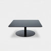 Black polished steel Flash Square Table by Tom Dixon featuring mirrored glass surface, modern design, and sleek geometric shape.