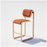 Tan leather Tube Counter Stool by Bend Goods featuring sleek metal legs and modern seating design for kitchen or bar areas.