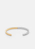Skultuna SB Cuff Thin two-tone 50/50 accessories featuring sleek, minimalist design with silver and gold finishes.