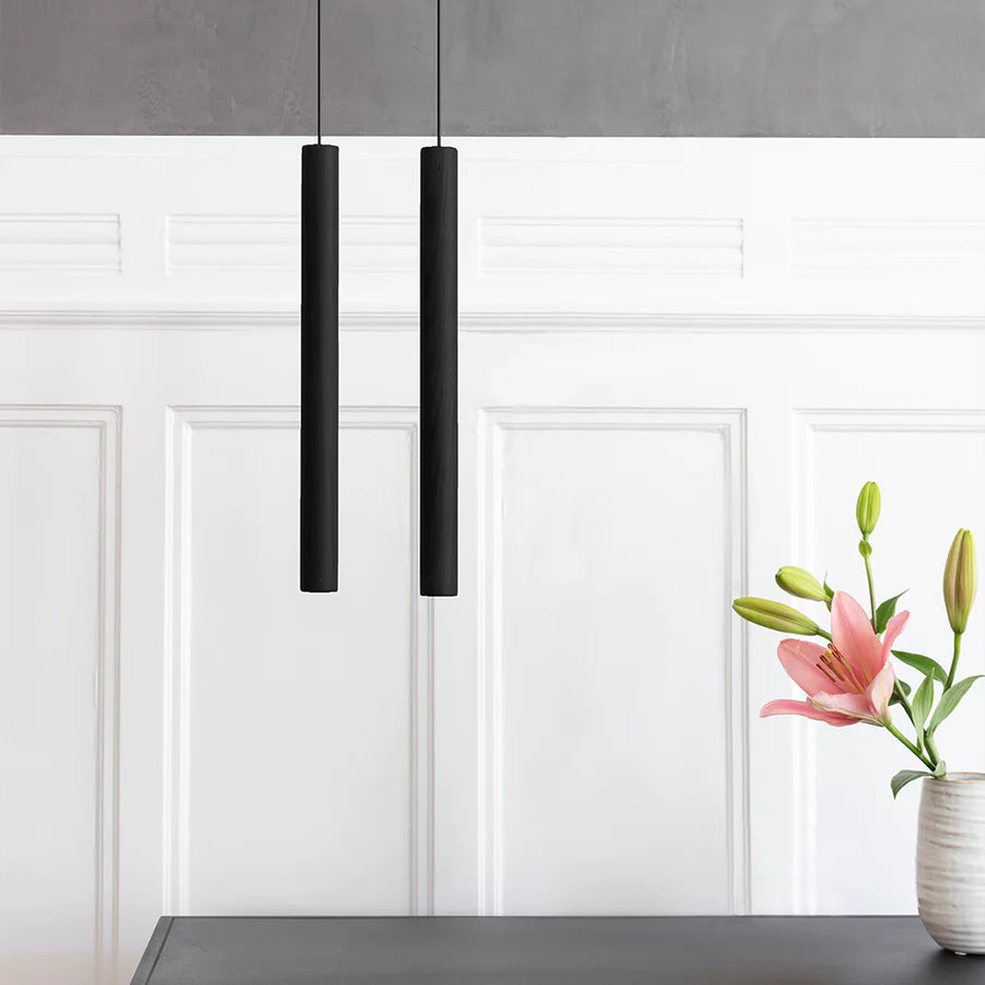 Tall oak pendant lamp from UMAGE's Chimes collection, showcasing a sleek, modern lighting fixture with a wooden finish.