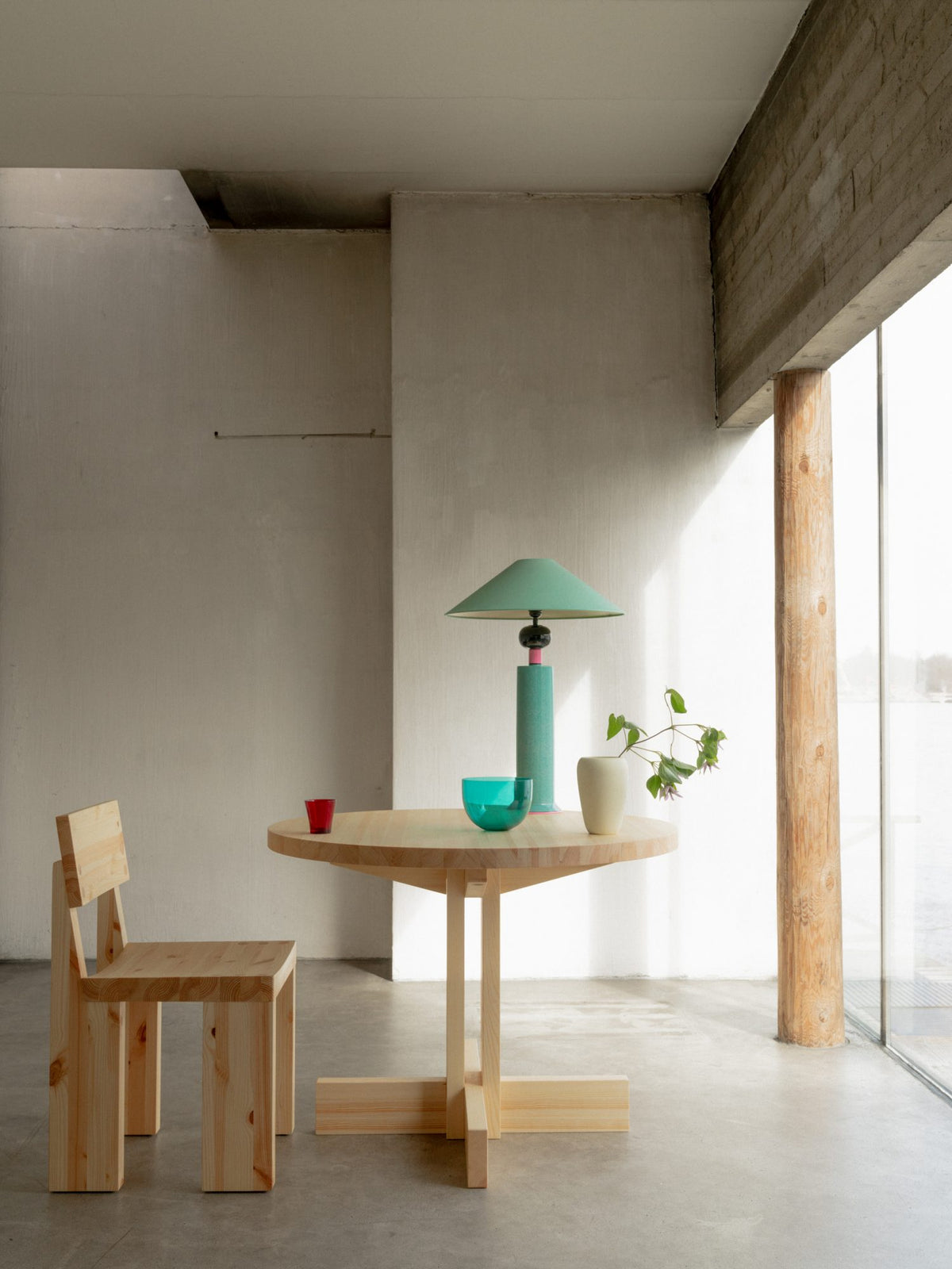 Round Vaarnii dining table with sleek wooden surface, showcasing modern design perfect for contemporary dining spaces.