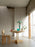 Round Vaarnii dining table with sleek wooden surface, showcasing modern design perfect for contemporary dining spaces.