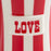 Jonathan Adler Vice Love mug with bold red and black design, ceramic accessory featuring a stylish love-themed illustration.