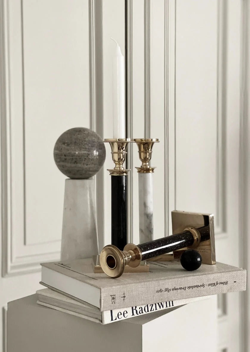Skultuna Jubilee Candle Holder in brass with a sleek, modern design, perfect for tabletop or mantle display.