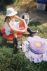 Colorful purple poppy design kids' floor cushion by Lorena Canals, featuring washable cotton fabric and plush, comfortable surface.