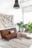 Natural-colored washable Rug Air by Lorena Canals, showcasing soft, durable fabric and stylish design in a cozy living space.