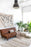 Natural-colored washable Rug Air by Lorena Canals, showcasing soft, durable fabric and stylish design in a cozy living space.