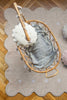 Beige washable rug named Biscuit by Lorena Canals, shown as a soft, plush accessory with a textured surface.