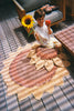 Kids' Sunflower washable rug by Lorena Canals featuring a bright sunflower design on soft, durable fabric.