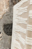 Lorena Canals Zagros Wool Area Rug in natural sandstone with geometric zigzag pattern, soft wool material.