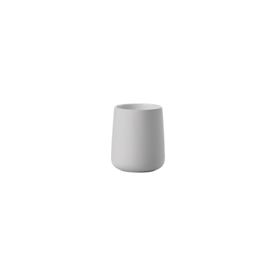 Black Nova Toothbrush Mug by Zone Denmark, a sleek bathroom accessory with a modern design for holding toothbrushes.