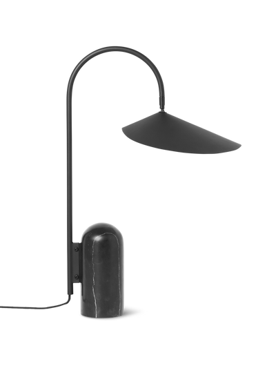 Ferm Living Arum Table Lamp with a sleek, modern design and a rounded base, perfect for ambient lighting in living spaces.