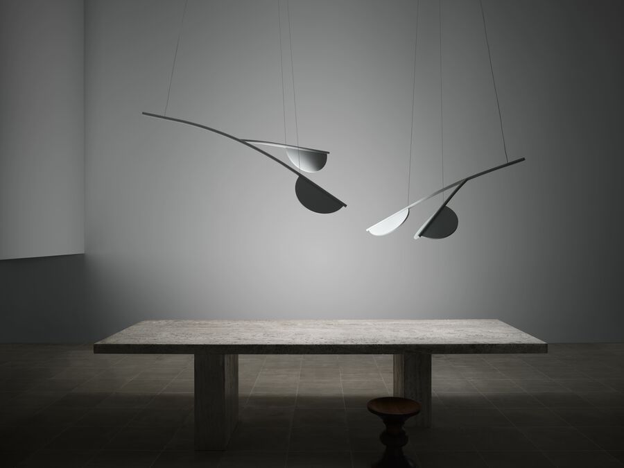 Almendra Organic Flos lighting fixture with off-white finish, showcasing its curved, modern design and sleek organic shape.