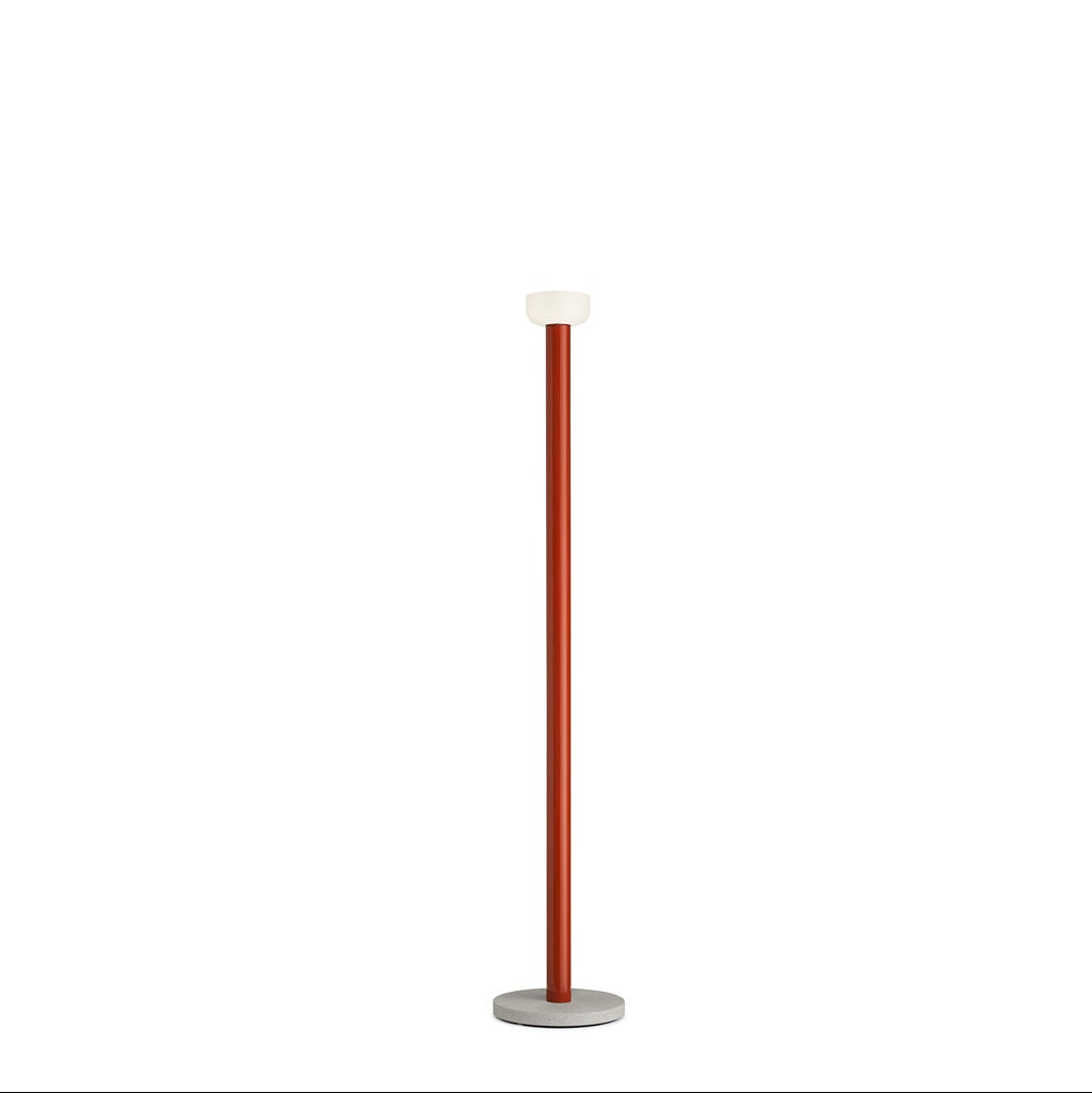 Bellhop Floor lamp by Flos featuring a sleek, modern design with a rounded shade and slim stand for stylish lighting.